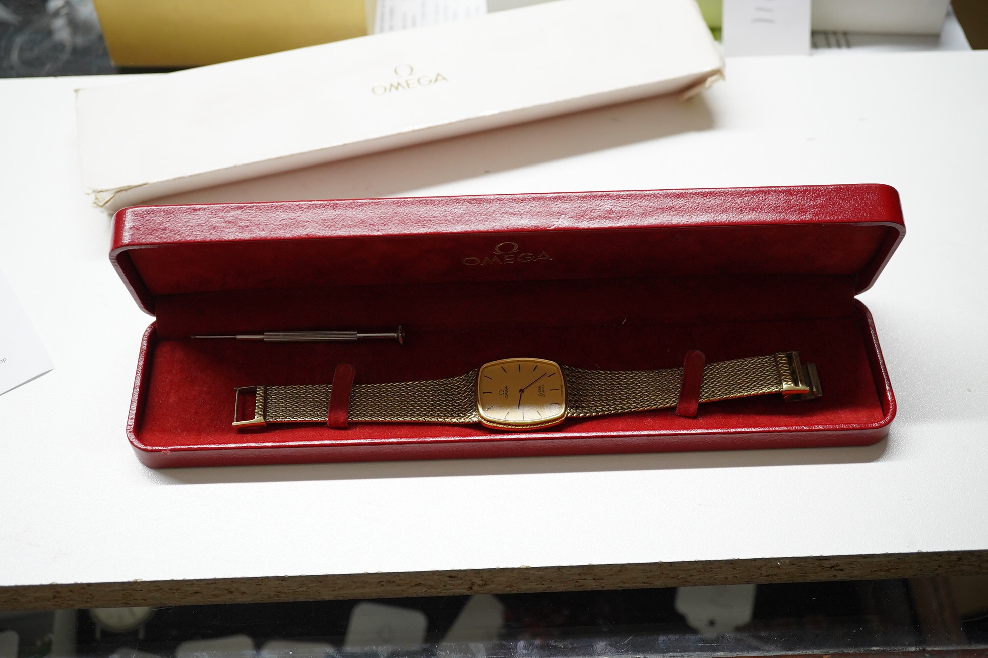 A gentleman's gold plated Omega De Ville quartz wrist watch, on a gold plated bracelet, with Omega box. Condition - poor